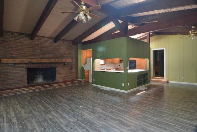 unfurnished living room with dark hardwood / wood-style floors, lofted ceiling with beams, ceiling fan, and a brick fireplace