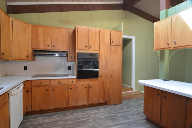 kitchen with lofted ceiling with beams, dark hardwood / wood-style flooring, black appliances, and wood walls