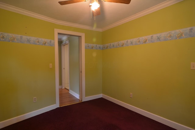 empty room featuring crown molding, ceiling fan, and wood-type flooring