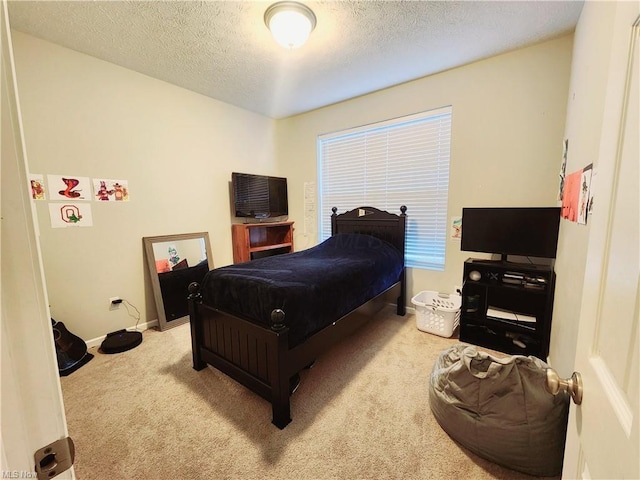 carpeted bedroom with a textured ceiling