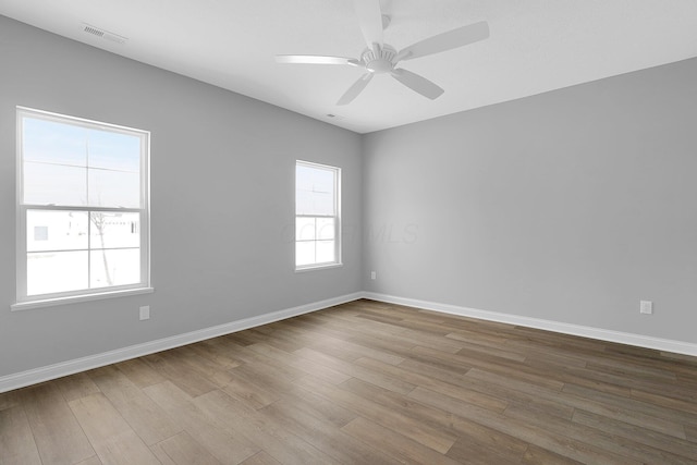 unfurnished room featuring ceiling fan and light hardwood / wood-style floors