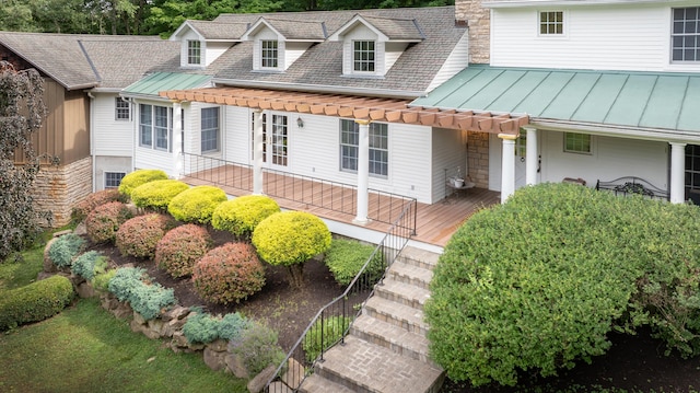 view of front facade with a pergola and a wooden deck