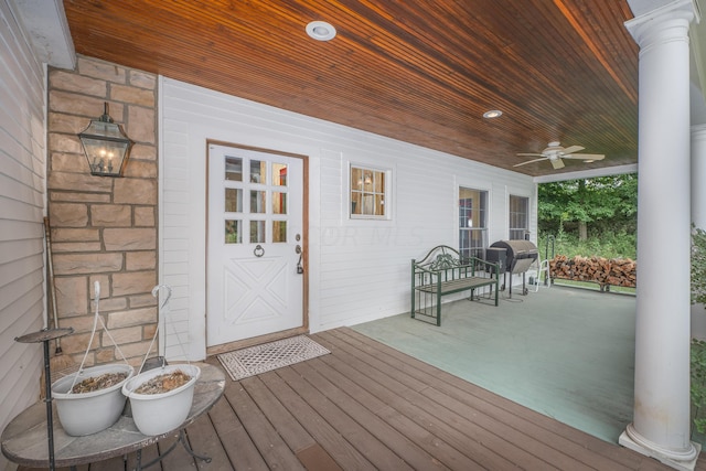 wooden terrace with ceiling fan and a porch