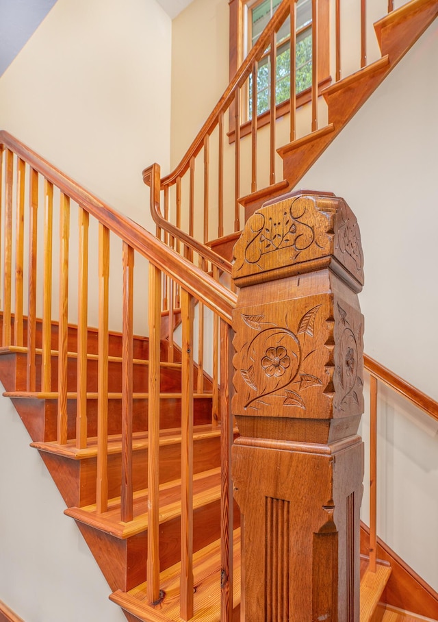 stairway featuring wood-type flooring