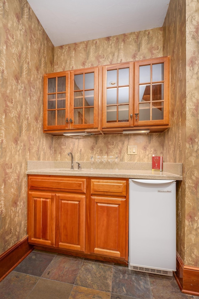 kitchen featuring dishwasher and sink