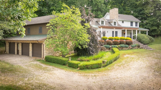 view of front facade with a porch and a garage