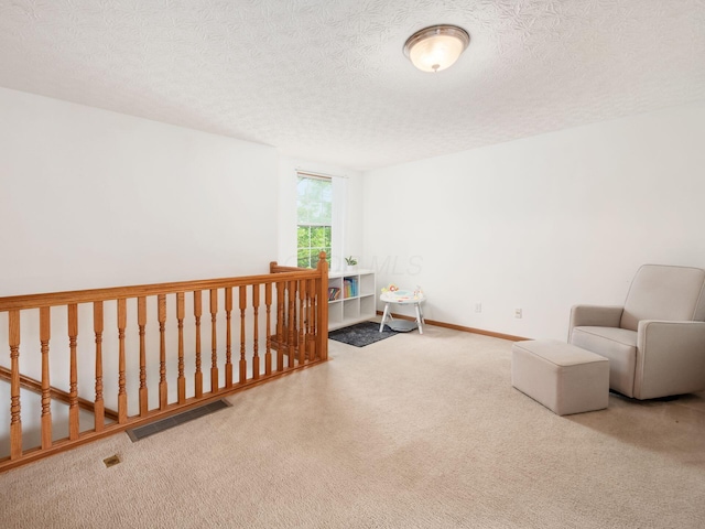 2124 Ripple Rd, Hilliard, OH 43026 - living area featuring carpet flooring and a textured ceiling