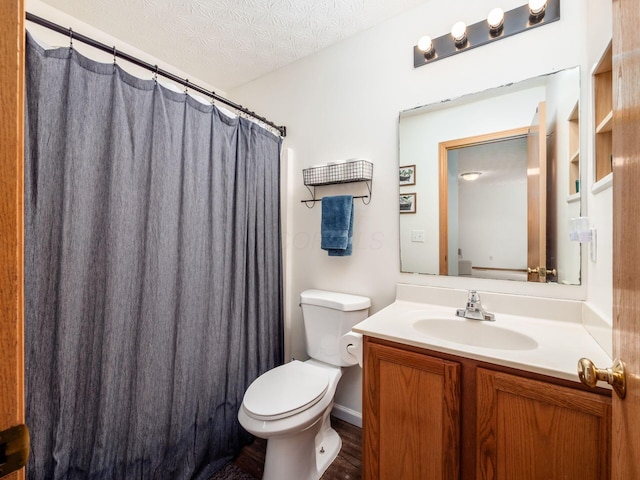 2124 Ripple Rd, Hilliard, OH 43026 - bathroom featuring toilet, vanity, a textured ceiling, and a shower with curtain