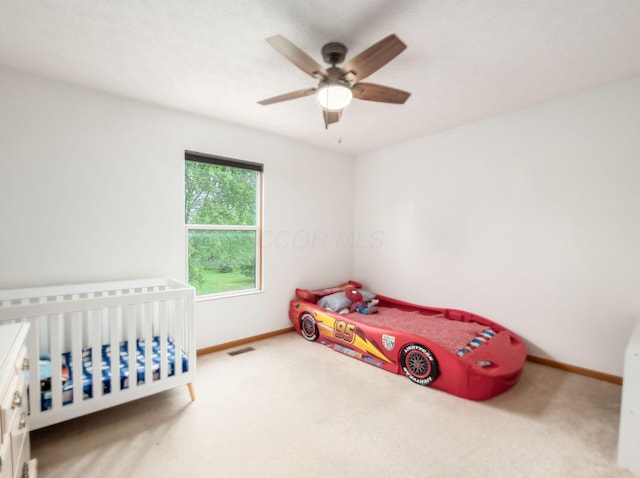 2124 Ripple Rd, Hilliard, OH 43026 - unfurnished bedroom with carpet flooring, baseboards, and a ceiling fan