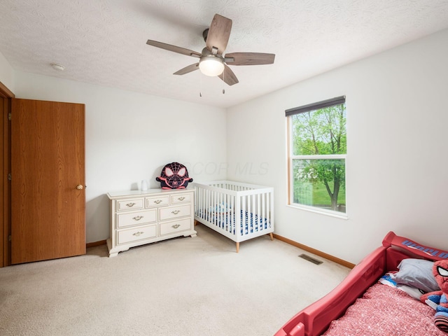2124 Ripple Rd, Hilliard, OH 43026 - bedroom with baseboards, carpet flooring, and ceiling fan