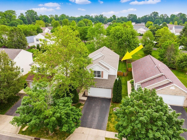 2124 Ripple Rd, Hilliard, OH 43026 - aerial perspective of suburban area featuring a tree filled landscape