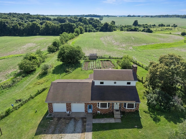 birds eye view of property with a rural view