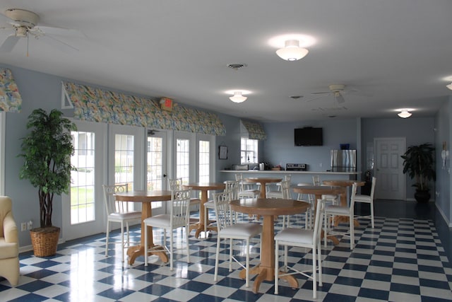 dining space featuring french doors and ceiling fan