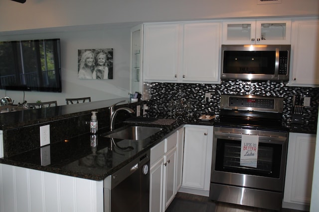 kitchen featuring sink, white cabinets, and stainless steel appliances