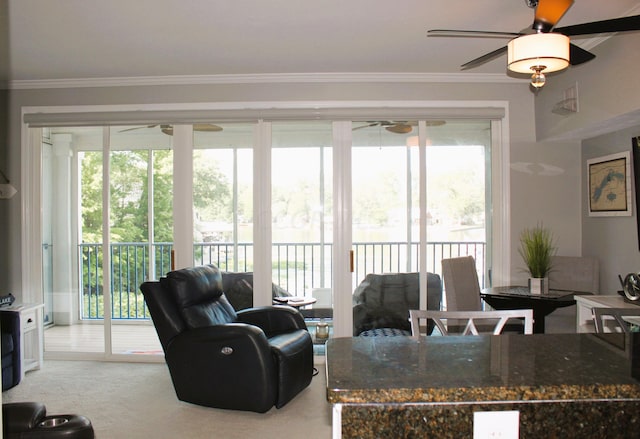 carpeted living room featuring ornamental molding