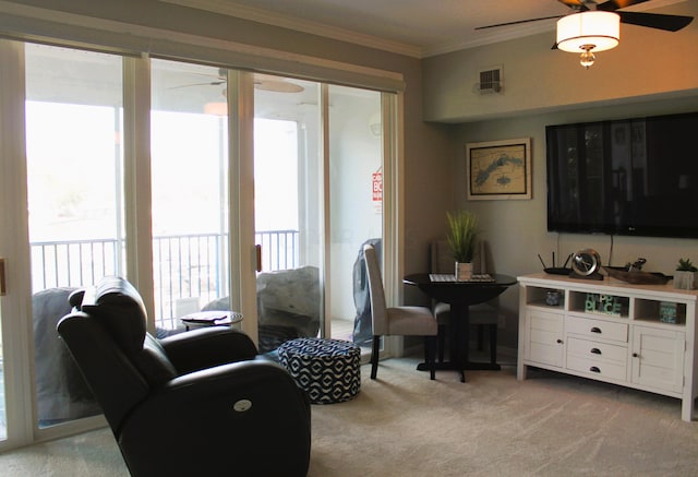 living room featuring crown molding and light carpet