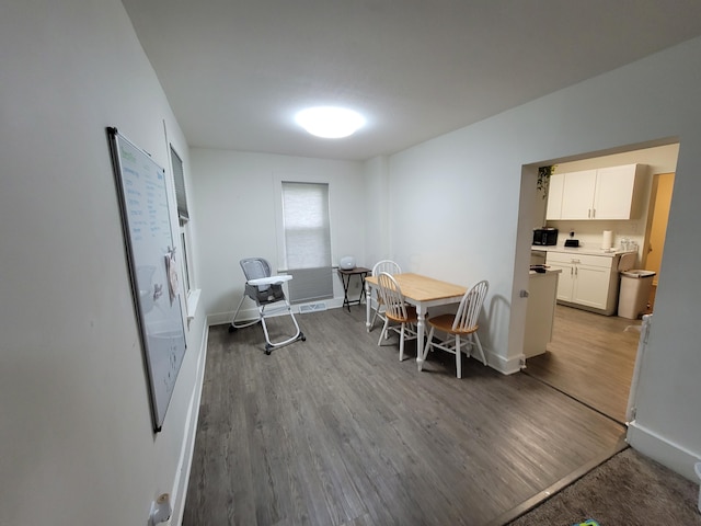 dining area featuring hardwood / wood-style floors