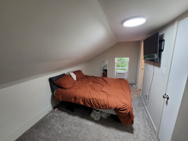 bedroom with light colored carpet, vaulted ceiling, and cooling unit