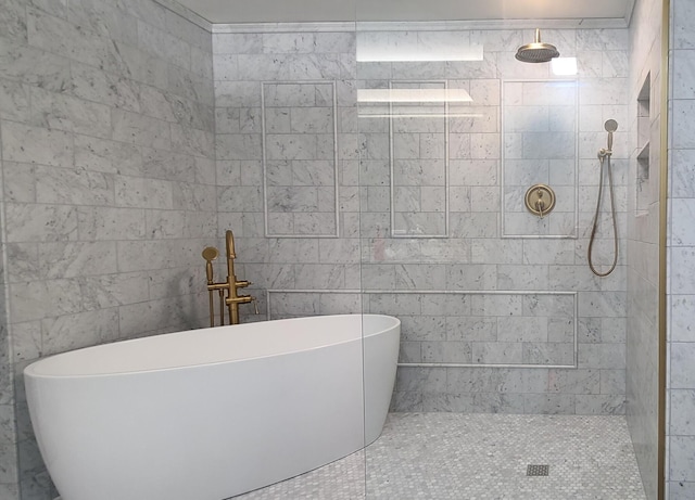 bathroom featuring shower with separate bathtub and tile walls