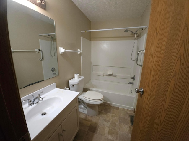 full bathroom with vanity, a textured ceiling, bathing tub / shower combination, and toilet