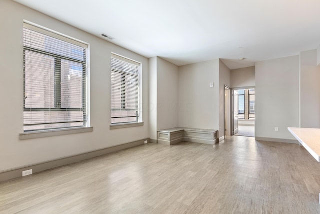 unfurnished room featuring light hardwood / wood-style floors