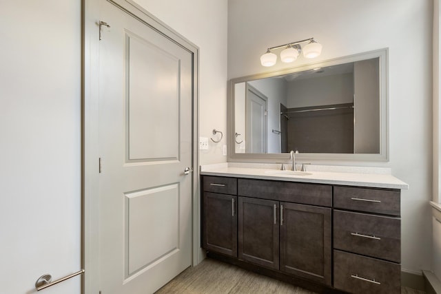 bathroom with vanity and hardwood / wood-style flooring