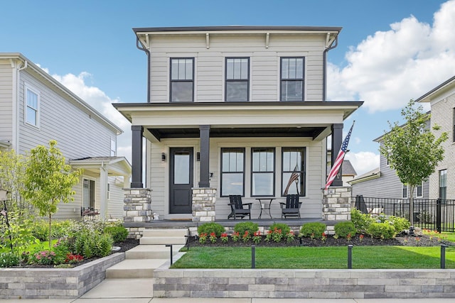 italianate house featuring a porch and fence