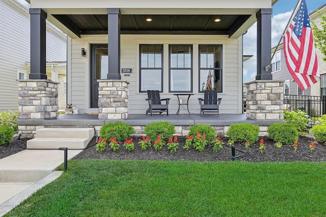 doorway to property with covered porch