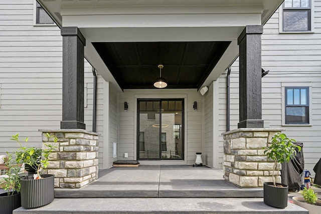 entrance to property featuring stone siding