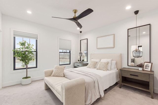 bedroom featuring a ceiling fan, recessed lighting, light carpet, and baseboards