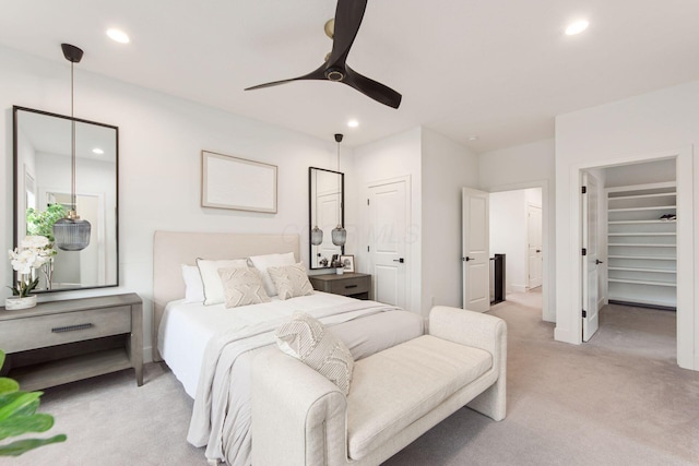 bedroom with a ceiling fan, recessed lighting, light carpet, and baseboards