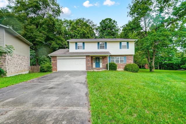 front of property featuring a front yard and a garage