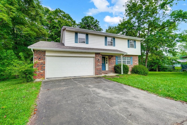 view of front of house with a garage and a front yard