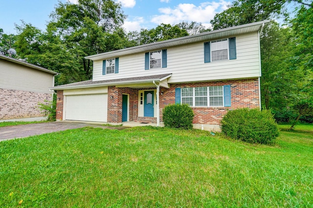 view of property featuring a front lawn and a garage