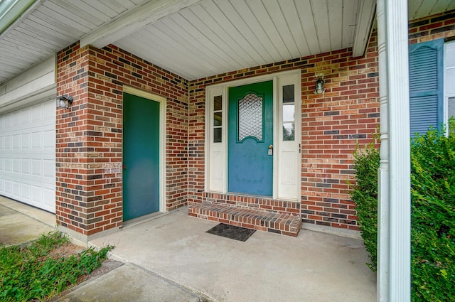 view of exterior entry featuring a garage