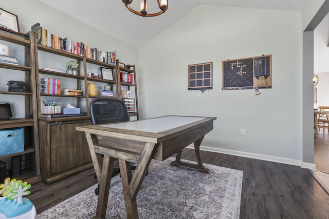 office area with a textured ceiling, dark hardwood / wood-style floors, vaulted ceiling, and an inviting chandelier