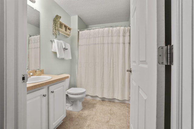 bathroom with vanity, a shower with shower curtain, tile patterned flooring, toilet, and a textured ceiling