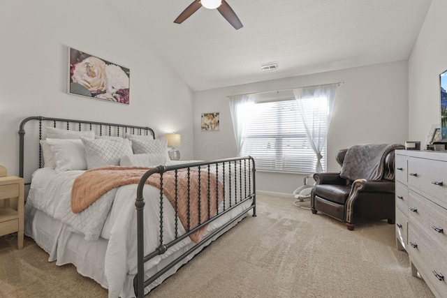 bedroom with light colored carpet, ceiling fan, and lofted ceiling