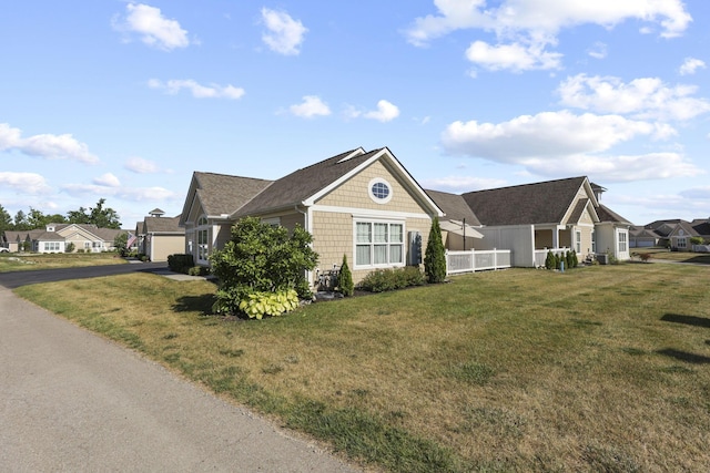 view of front of home with a front lawn