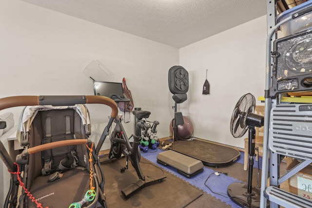 workout area with a textured ceiling