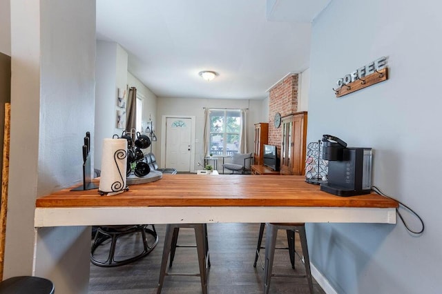 home office with dark wood-type flooring