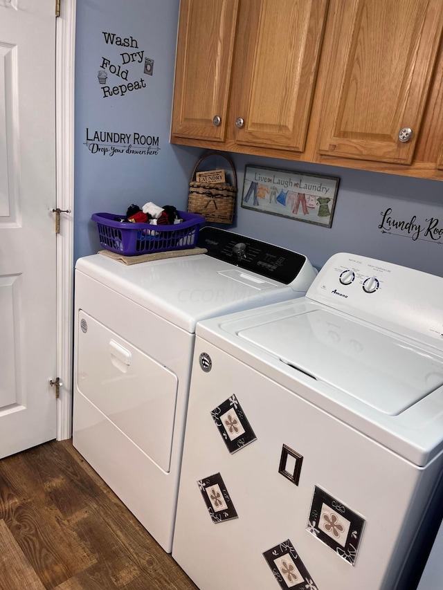 clothes washing area featuring cabinets, independent washer and dryer, and dark wood-type flooring