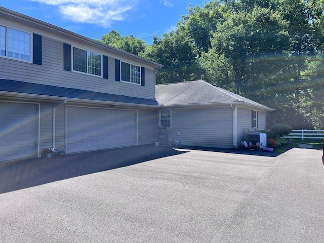 view of side of property featuring a garage