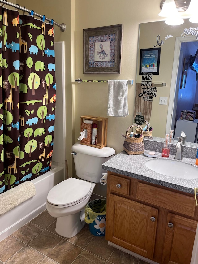 full bathroom with tile patterned floors, vanity, toilet, and shower / bath combo with shower curtain