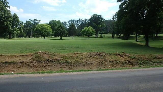 view of home's community featuring a lawn