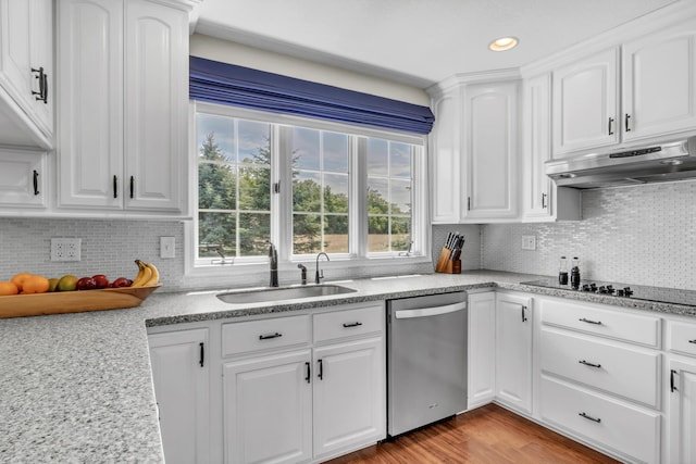 kitchen with dishwasher, backsplash, sink, light hardwood / wood-style floors, and white cabinetry