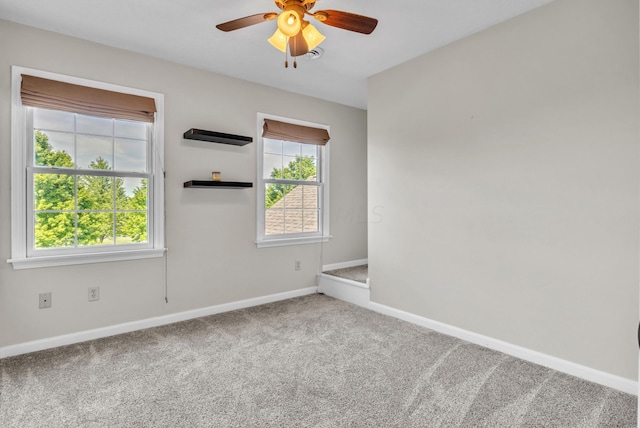 spare room with carpet flooring and ceiling fan