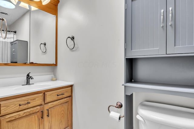 bathroom with vanity and toilet