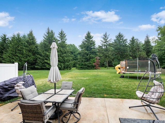 view of patio / terrace with a playground and a trampoline