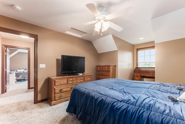 bedroom with ceiling fan, light colored carpet, a textured ceiling, and vaulted ceiling